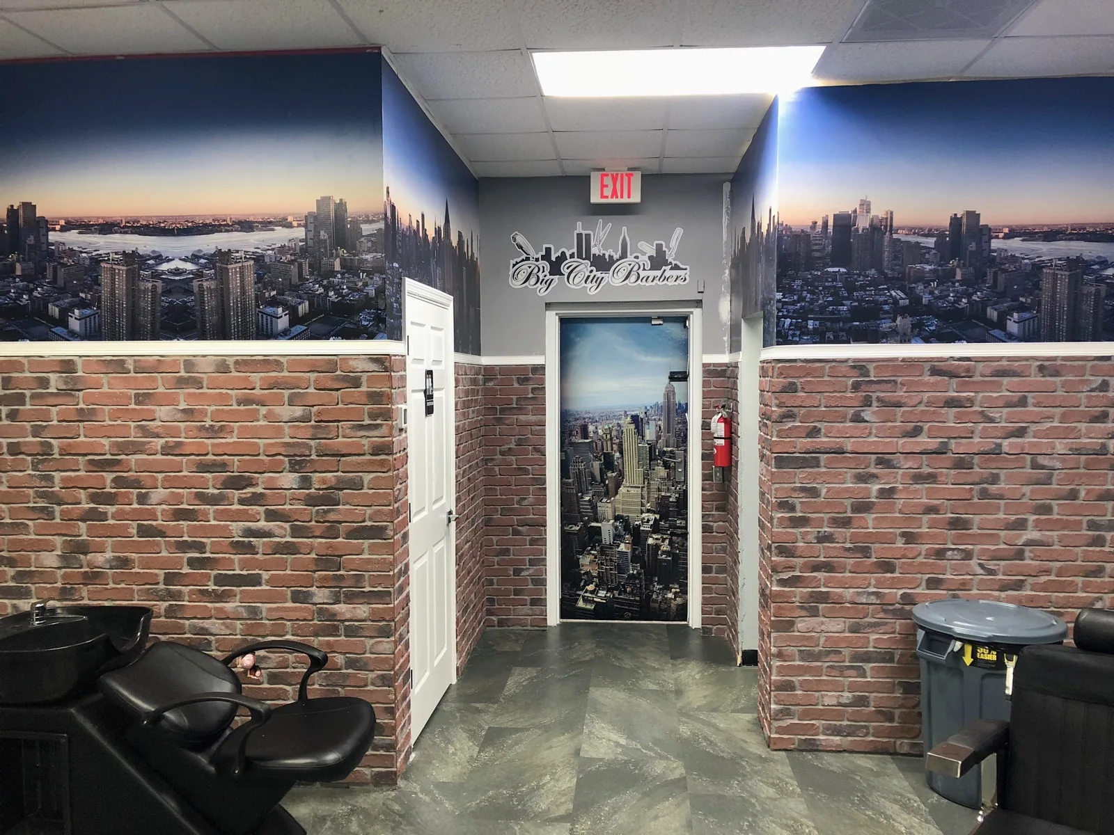Big City Barbers — Door wrapped with a city street scene and a logo graphic on the skyline mural wall, Big City Barbers project