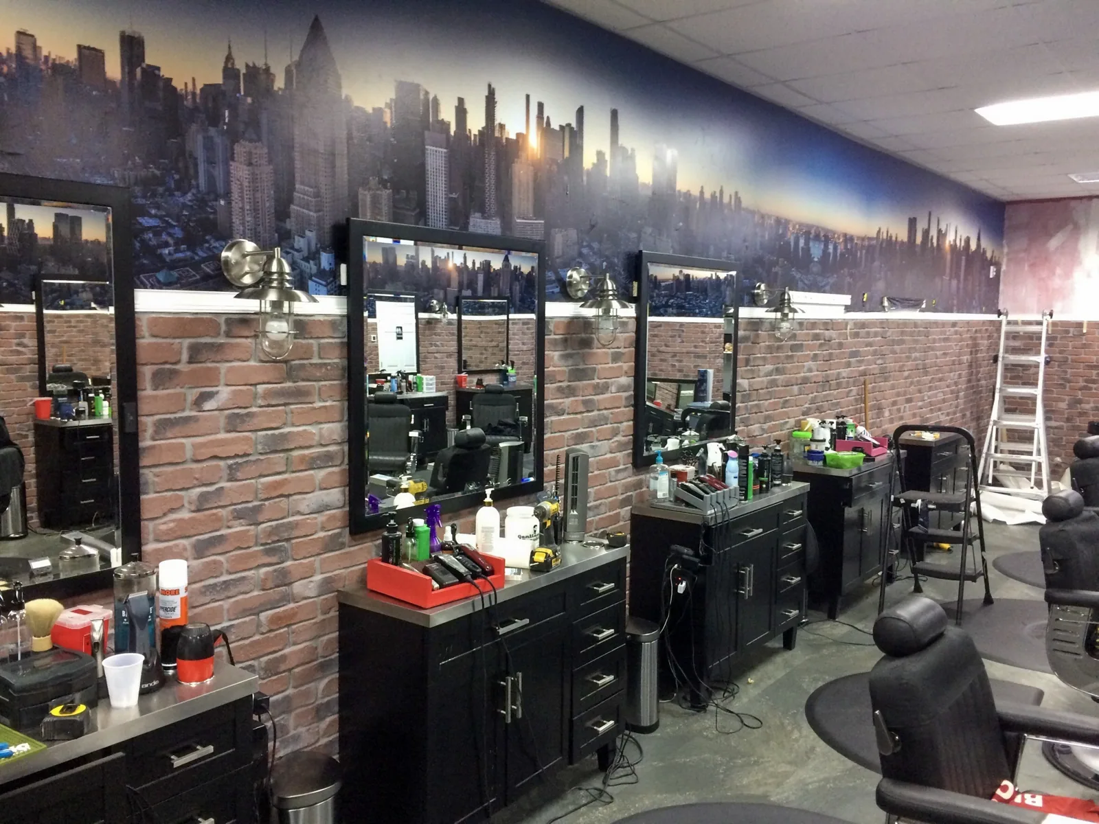 Big City Barbers — Barber stations under a wraparound skyline wall mural, Big City Barbers project