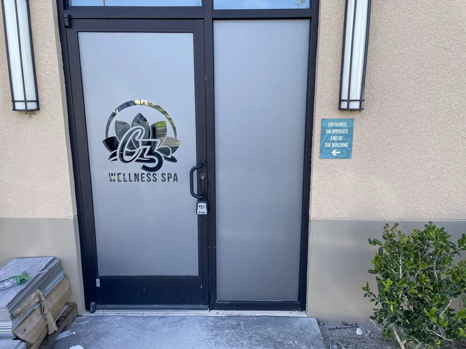 C3 Wellness Spa — Frosted vinyl door graphic with the C3 Wellness Spa logo at an exterior entrance, C3 Wellness project
