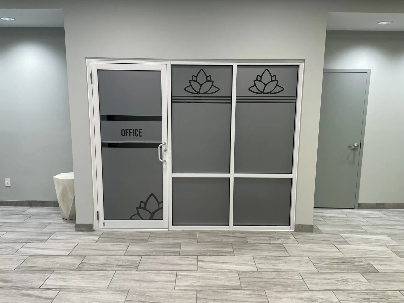 C3 Wellness Spa — Frosted window film with lotus graphics on interior office glass doors, C3 Wellness project