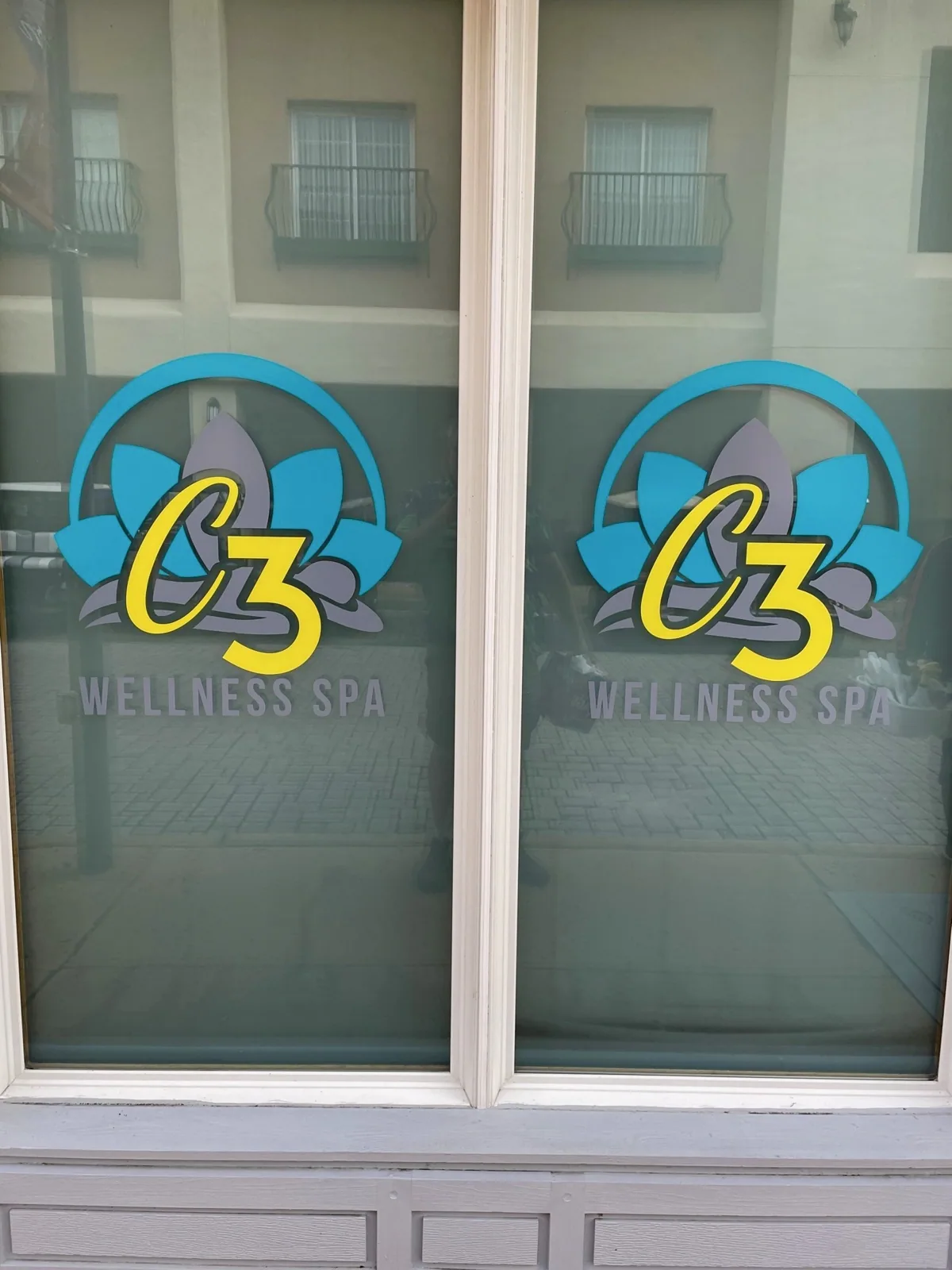 C3 Wellness Spa — C3 Wellness Spa logo graphics on a pair of window panes, C3 Wellness project