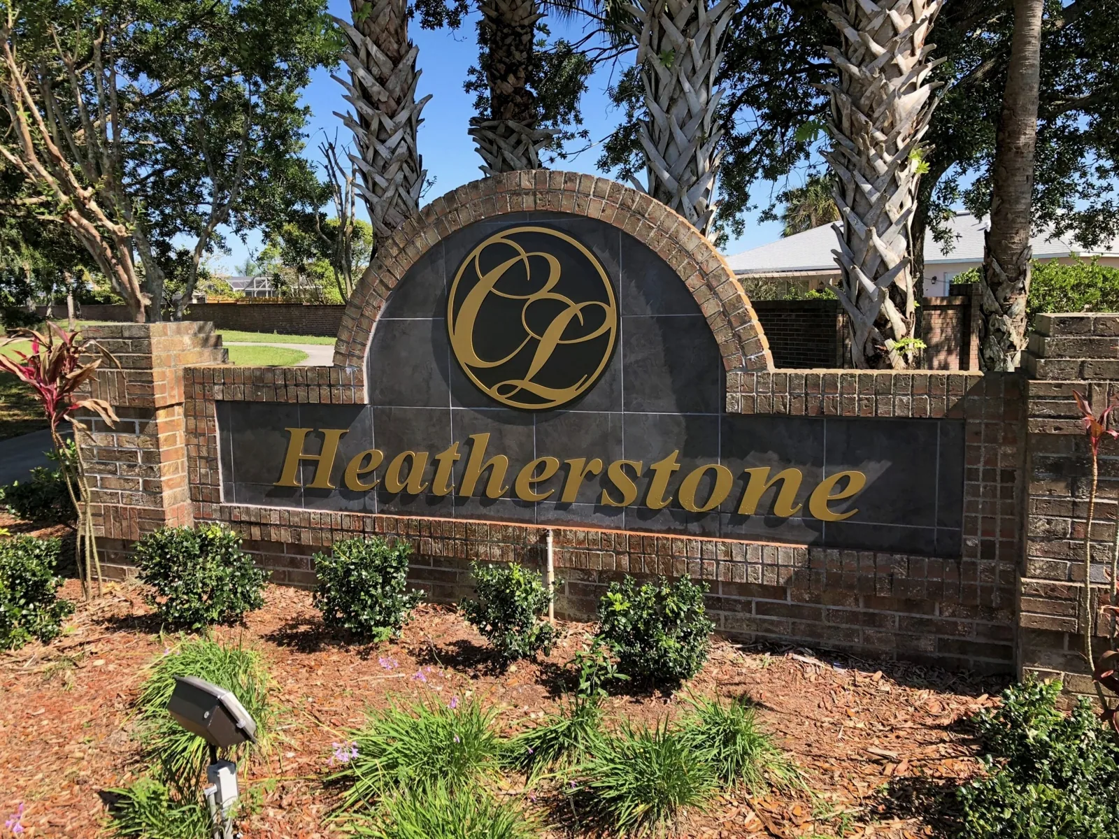 Crescent Lakes — Heatherstone brick neighborhood monument sign with gold letters and CL logo, Crescent Lakes project