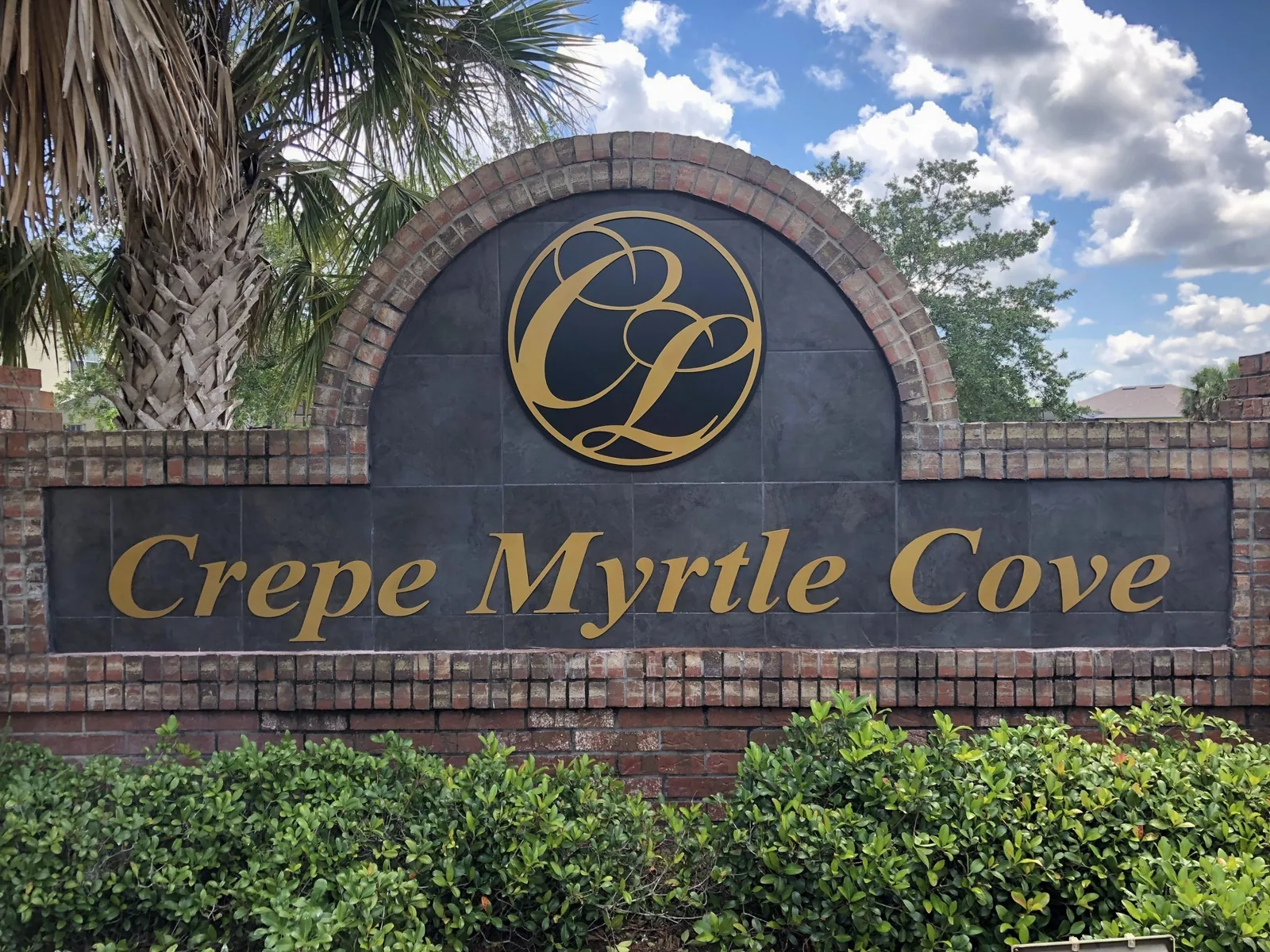 Crescent Lakes — Crepe Myrtle Cove brick neighborhood monument sign with gold letters, Crescent Lakes project