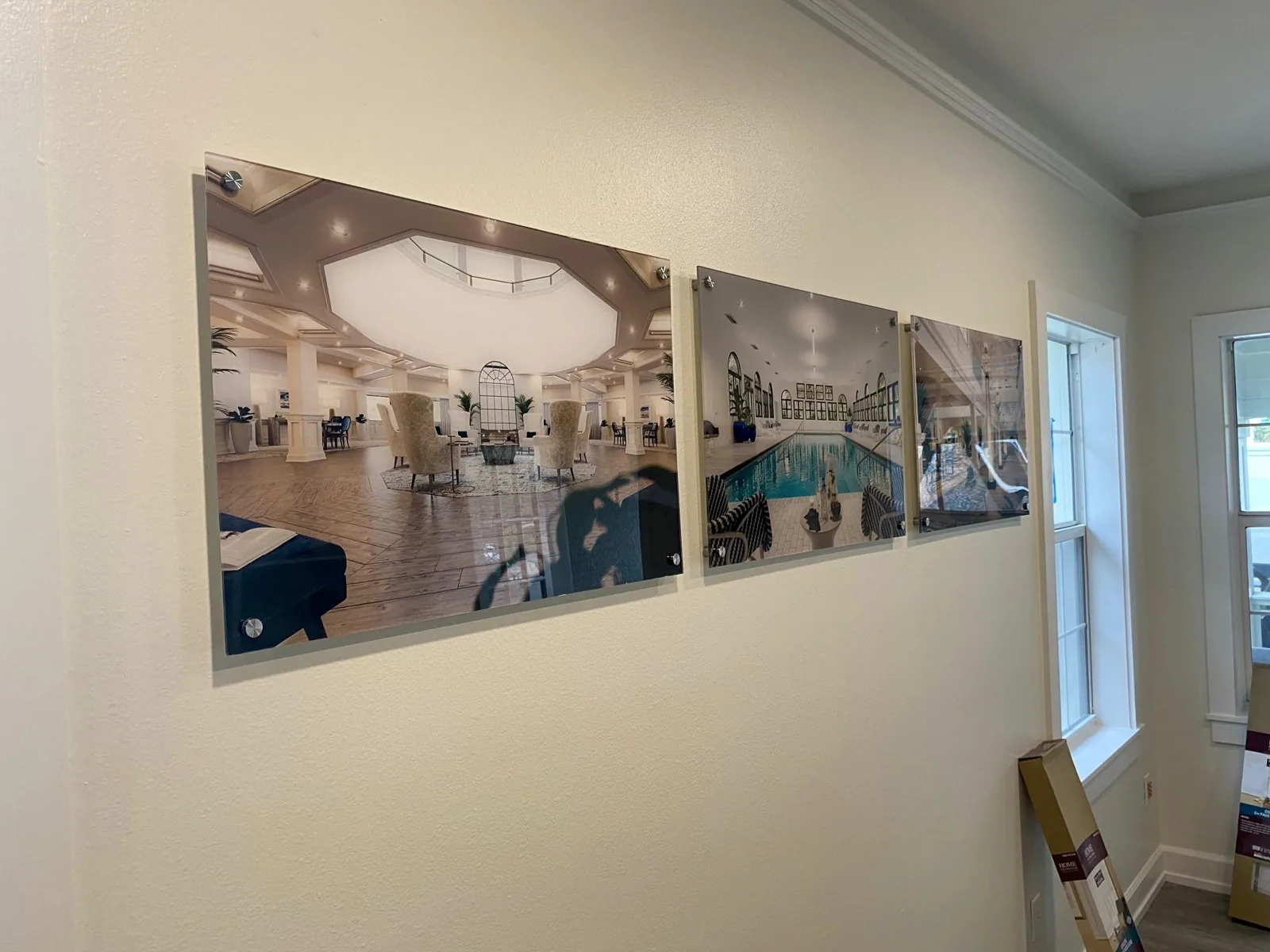 Unisen Senior Living — Three wall-mounted photo print panels in a sales center room, Unisen Senior Living project