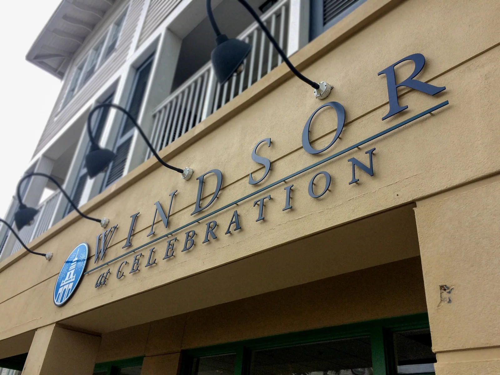 Windsor at Celebration dimensional letters and round logo on the building facade above the entrance, Windsor at Celebration project
