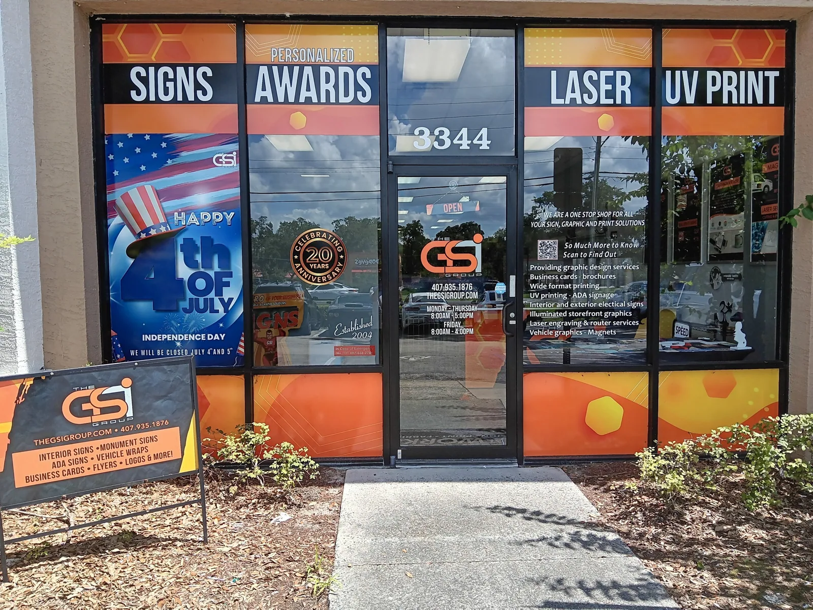 GSI Custom Signs & Graphics shop front at 3344 S Orange Blossom Trail, with window graphics for signs, awards, laser and UV print
